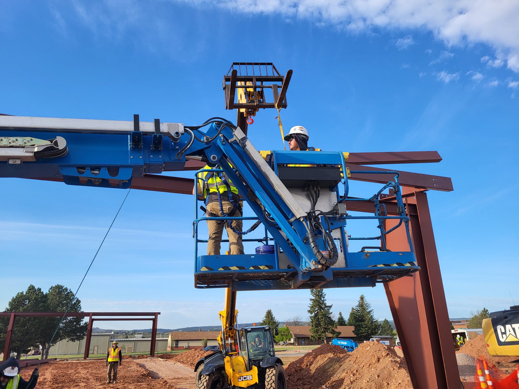WagCo Construction crew coordinating crane work at Camp Rapid