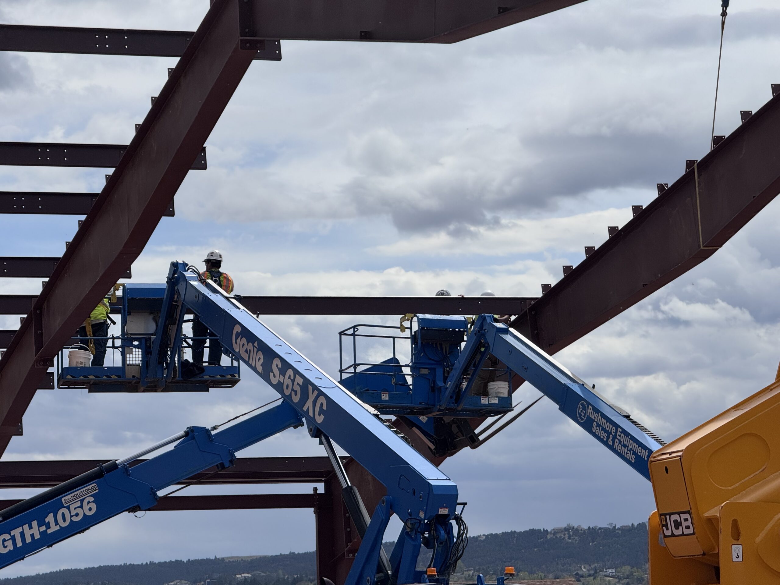 Steel beams and lift equipment during Camp Rapid construction by WagCo Construction
